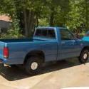 1988 GMC S15 pickup truck with camper shell, towing hitch, boat and trailer
