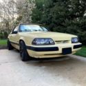 1989 Ford Mustang LX Coupe / Notch - Tropical Yellow