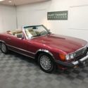 1989 MERCEDES BENZ 560SL CONVERTIBLE. GARNET RED. 76,078 MILES. NICE CONDITION.