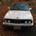 1990 BMW 325i.  White with navy roof and navy interior.  It needs work.