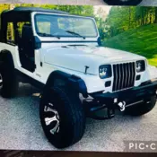 1990 Jeep Wrangler YJ lifted w/soft top, new tires and rims, and many new parts.
