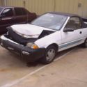 1992 (white) GEO Metro Convertible   (some front end damage)