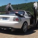 1994 Honda Del Sol/Civic hybrid. This was a show/street racer.GLOWS IN THE DARK!