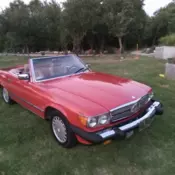 560 SL,   Signal Red. Saddle interior, both tops, Preceded by 1988