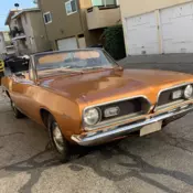 69 Barracuda Convertible with low miles, clean title, bucket seats, 318 engine.