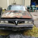 77    firebird     trans am   w Hurst  T Tops  (  for parts )   (  no papers ).
