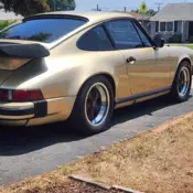 911 SC Porsche 1983 comes in a sleek gold exterior has low mileage 109,736