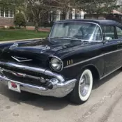 A 1957 Chevy Bel Air 210 sedan, other than its stock exterior, has been modified