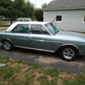 A 1964 Rambler Ambassador 990 Blue with white top.