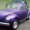 a 1971 super beetle with flat windshield.