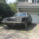 A Ventage Collector Car, Black exterior, Burgundy interior, 4 door with Air.