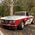 Alfa Romeo GTV race car with vintage livery and rebuilt engine.