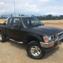 Black 1994 Xtra-Cab Toyota Hilux 4x4, stick shift, V6