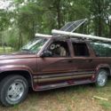 chevy suburban 4 x 4 Camper with solar panels