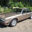 Classic Jag! Runs quietly but needs some work.