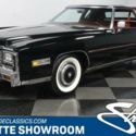 classic vintage caddy chrome black red luxury white walls tailfins