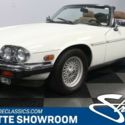 classic vintage chrome British sports car drop rag top low miles white tan