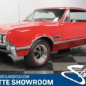 classic vintage chrome muscle car black vinyl interior triple carb
