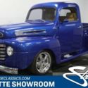 classic vintage chrome polished dual Edelbrock carb blue tan chevy v8 power