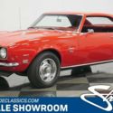 Classic vintage red first generation Camaro small block Chevy