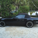 covertible black with saddle interior low miles,55000,new wheels and tires .