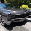 Custom 1967 Cadillac DeVille sitting on 22&#034; wheels and shaved doors.