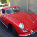 Exterior Red with Black interior coupe, in very clean mint condition.
