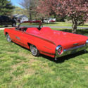Ford Thunderbird with all the Roadster equipment, red inside & out , white top