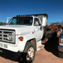 GMC 7000 V8 diesel 16 ft stake bed flatbed dump truck
