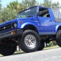 Great color combination. 1.3 Liter, 5-speed manual. 4x4, black convertible top!