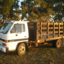 Isuzu NPR  diesel 1990 flatbed with removable sides