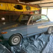light blue 2 door sedan