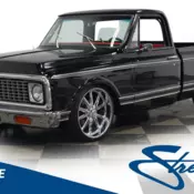 Nice lowered stance with 22" US Mag wheels short bed power brakes and steering