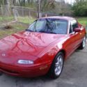 nice red miata with hardtop