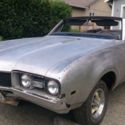 Not a Cutlass. A real Ebony black 442 convertible. Disc Brakes and 12 bolt posi