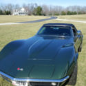 Numbers matching 350/350 corvette conv dark green with black top & interior