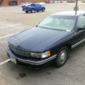 Prestige Model, dark blue, 4 door sedan, has most options available
