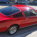 Red 1965 Ford Mustang fastback. great condition. second owner. 4 speed manual.