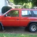 Red 1993 Nissan Pathfinder