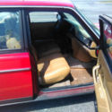Red with racing stripes, leather front seats