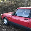 Saab 900 Turbo SPG (1990) in Talladega Red paint with the original SPG rims.