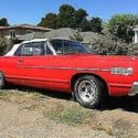 This 1967 Mercury Monterey is shown in a Tomato Red exterior with Red/White inte