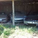 Three Porsches in a barn