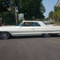 White Cadillac Coupe Deville with 65,000 Miles available now!