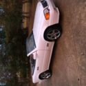 White hardtop convertible. Custom wheels