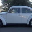White/1600cc/Black Interior/Factory Sunroof/Front Disc Brakes