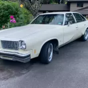 Yellow 1975 Oldsmobile Cutlass 4-dr V8 260